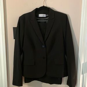 Calvin Klein black skirt suit.   New. Never worn.